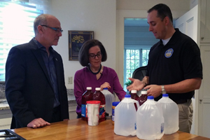 Gov. Kate Brown, Dan Little and OOEM Director Andrew Phelps bukld a 2-week emergency supply kit at Mahonia Hall in Salem April 12, 2016